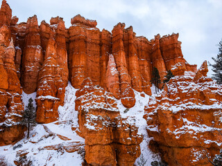 Snow scene colorful cliffs with red rock and stone in Bryce Canyon National Park