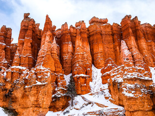 Snow scene colorful cliffs with red rock and stone in Bryce Canyon National Park