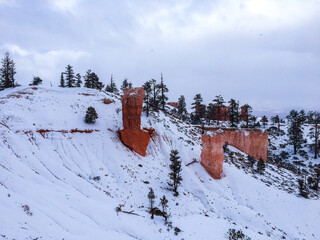 Snow scene colorful cliffs with red rock and stone in Bryce Canyon National Park