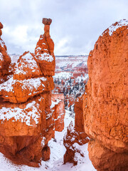 Snow scene colorful cliffs with red rock and stone in Bryce Canyon National Park