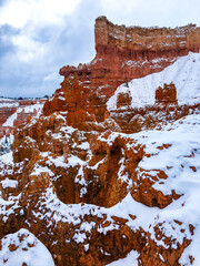 Snow scene colorful cliffs with red rock and stone in Bryce Canyon National Park