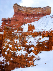 Snow scene colorful cliffs with red rock and stone in Bryce Canyon National Park