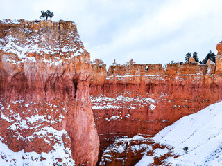 Snow scene colorful cliffs with red rock and stone in Bryce Canyon National Park