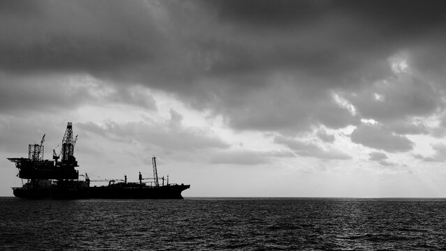 Drilling rig and FPSO ship black and white silhouette, Offshore oil field, oil and gas industry