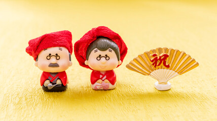 日本の還暦　還暦祝い　長寿のお祝い　赤い帽子とちゃんちゃんこ