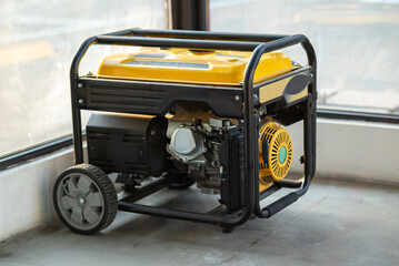 Portable electric generator running in the cold winter.Energy genocide. Small business use gasoline...