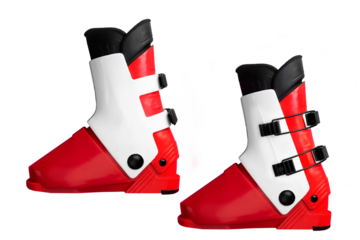 Red and white ski boots with black buckles on isolated background.