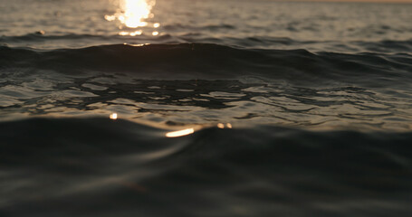 waves at sunset close up photo