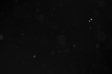 abstract dust particles over black background for overlay