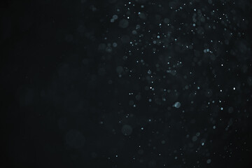abstract real dust floating over black background for overlay