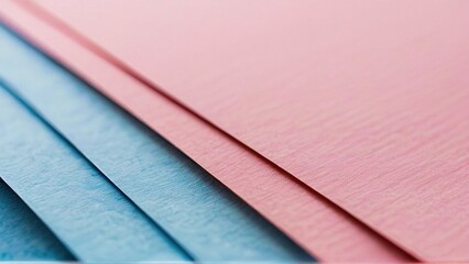 Close-up shot of pink and blue papers arranged in diagonal lines.