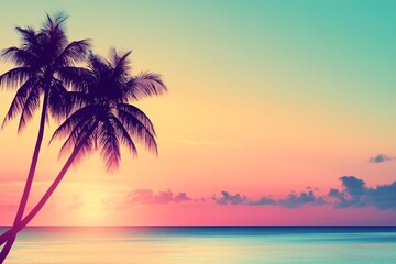 Stunning silhouette of palms at sunset. The sun is low in the sky, glowing orange. Beach and travel background. Blurred background. Copy space.