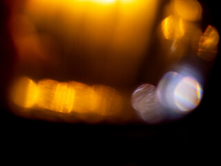 Abstract bokeh background with warm color. Digital background for design. Lens flare and light glow. Visual effect.