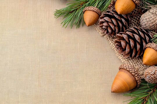 Handmade Thanksgiving decorations in a country farmhouse, featuring natural elements like pine cones, acorns, and burlap
