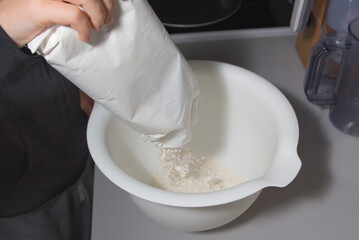 Pour flour from the bag into the mixing bowl