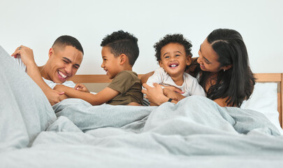 Relax, happy family and play in bedroom, laughing and brothers bonding together in home. Morning,...