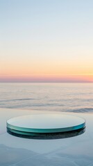 A low,thin, disc-shaped platform of clear glass mirrored product display, The sea is as clear as a mirror, and the first light of dawn shines in the no cloud sky, low saturation 