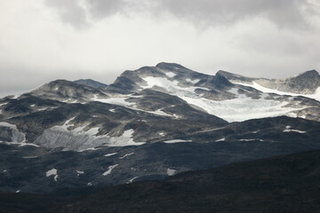 mountainrange in norway covered by glaciers 
