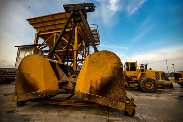 Dual bucket elevators, and yellow excavators in the mineral and aggregate industry