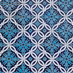 colorful ancient traditional Uzbek pattern on the ceramic tile on the wall of the mosque, abstract background