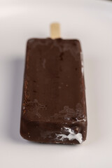 natural eco-friendly ice cream in chocolate glaze lies on a plate