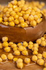 chickpeas porridge with honey during cooking