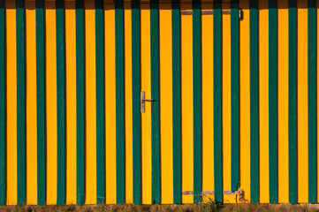 Strip facade and hidden door, yellow and green colour