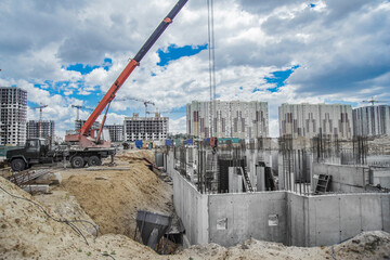 Column formwork and crane on house construction.