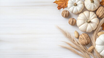 Enchanting autumn harvest table setting featuring pumpkins, nuts, and vibrant leaves on a white wooden backdrop for a cozy celebration