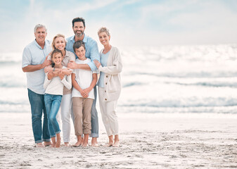 Hug, portrait and smile with family on beach together for holiday, travel or vacation. Love, mockup space or summer with senior people, parents and sibling children outdoor for bonding or wellness