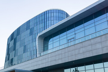 Obraz premium modern architecture, glass facade element of contemporary building against evening sky