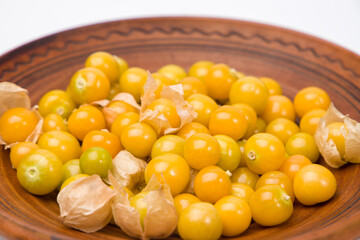 Cape gooseberry, physalis in a bowl on white background