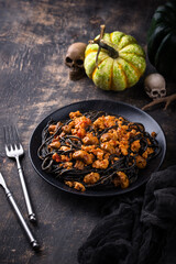 Halloween dish black pasta with bolognese