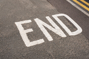 End writing on tarmac