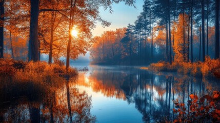 Fototapeta premium Autumn forest reflecting in calm lake at sunrise