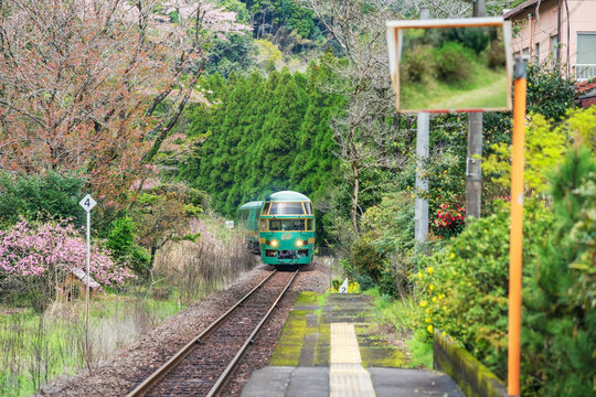 Yufuin No Mori train run on railway through Bungo Nakagawa station