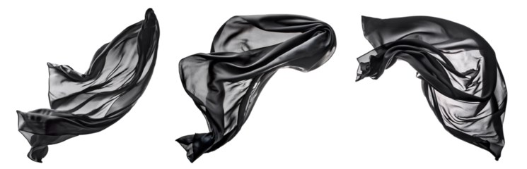 Three transparent dark silk scarves float in the wind, the light comes from behind. 
