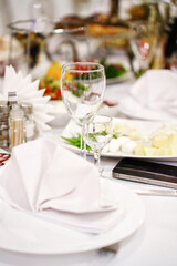 served banquet table with dishes and drinks.