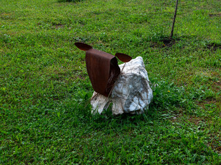Cow garden statues, milk farm eco-friendly stone and iron sculptures on the green grass lawn....