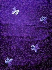 purple fabric pattern and background with leaf design