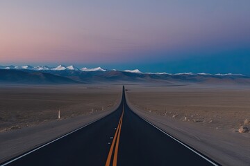 Fototapeta premium Expansive Road Journey Through Vacant Valleys and Peaks Under a Dusk Sky