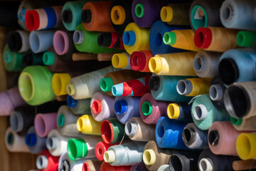 Spools of multi-colored threads.