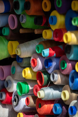 Spools of multi-colored threads.