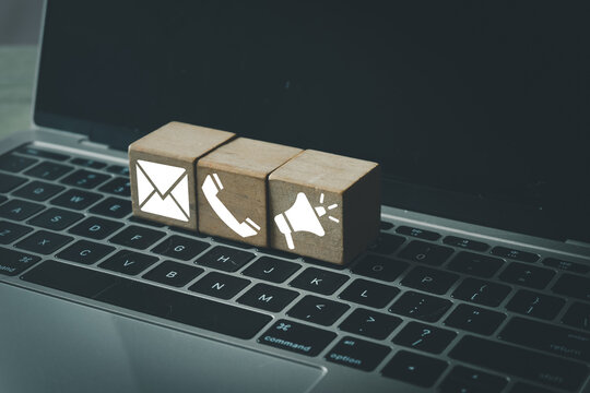 Digital Communication,Business Communication, networking, corporate messaging,social media,digital platforms concept.,Wooden cube with email,telephone and megaphone icon idea for notification.