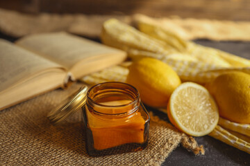 Candle, lemons and a book, summer mood