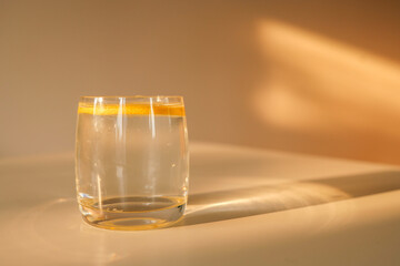 Glass of water with lemon, good morning concept