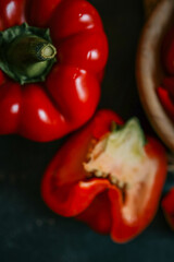 Red bell pepper on black background