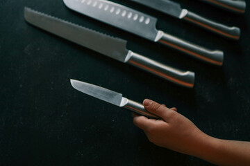 Casting steel various chef knife, Set of modern sharp kitchen knives on dark background