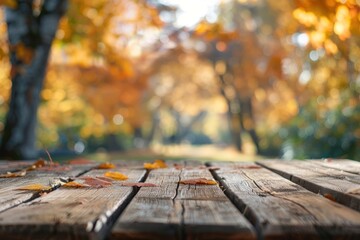 A striking empty wooden table with a background of yellow spring leaves, perfect for presenting products and merchandise in the beauty, cosmetics, and more.