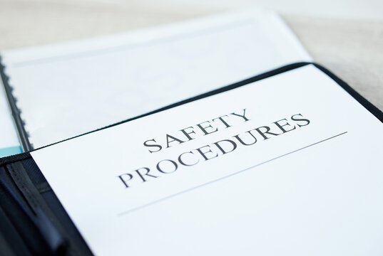 Workplace, safety and procedures with documents above for business compliance, insurance or security at office. Top view, paperwork or contract with desk for guideline, regulations or policy at work